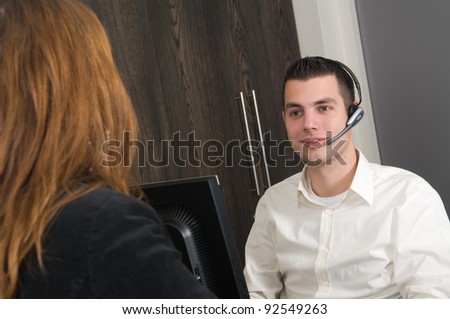 Customer getting some information at a service desk
