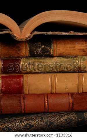 Stack of old classic bound books.