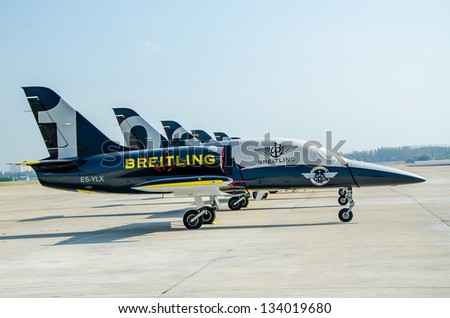 BANGKOK THAILAND - MARCH 23 : The Acrobatic Britling Jet Team performed at event of Breitling Jet Team Under The Royal Sky at Royal Thai Airforce Base Donmuang on March 23, 2013, in Bangkok Thailand.