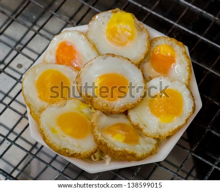 Fried quail egg on foam