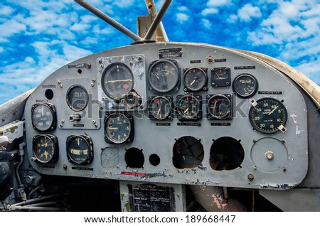 Cockpit of old airplane on blue sky background