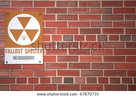 A sign indicating the whereabouts of a fallout shelter.