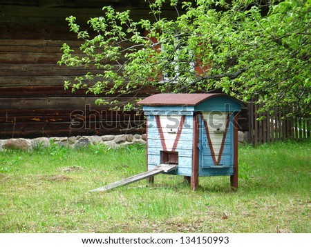Old blue hive in the garden in Lithuania