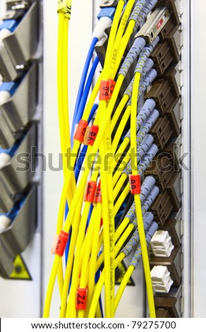 Fiber Optics connectors. Internet Service Provider equipment. Focus on fiber optic cables. Data Network Hardware Concept.