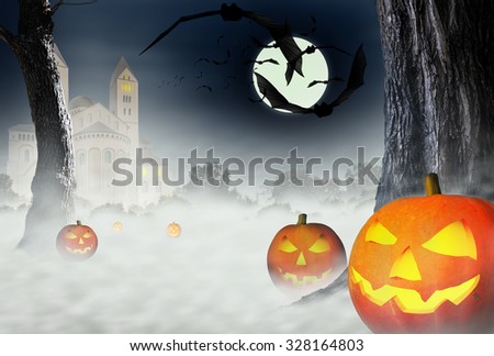 The night of Halloween. Bats and Halloween pumpkins on the background of the gloomy house and the forest in the fog