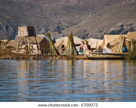 Floating Uros Island boats on Lake Titicaca in Peru