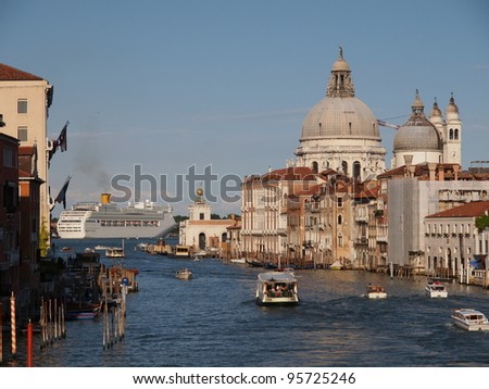VENICE, ITALY - JULY 2: The tourism season starts, and tourist and locals travel in Gondolas and boats on the Grand Canal of Venice, Italy July 2, 2011 in Venice, Italy