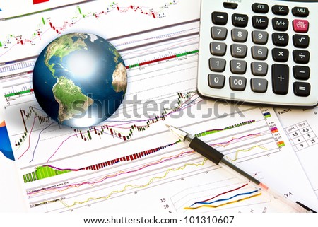 Pen and business graph with earth (Elements of this image furnished by NASA)