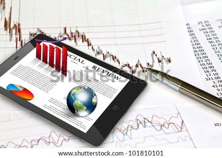 Touch pad and financial Graphs (Elements of this image furnished by NASA)