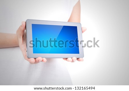 Woman hand using a touch screen device against white background
