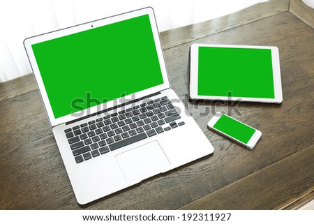 laptop with tablet and smart phone on table