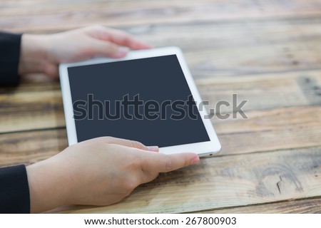 Woman hand touch white tablet with blank empty screen  ( with separate layer clipping path : Screen,Side hand )