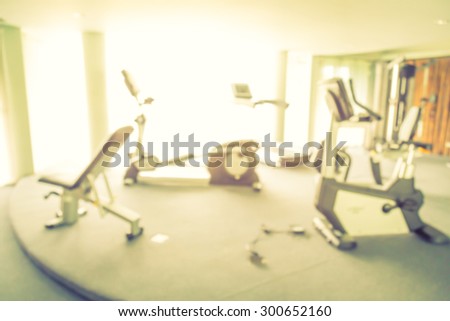 Abstract blur Fitness center with traineger equipments  ( Filtered image processed vintage effect. )