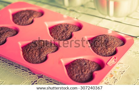 Chocolate muffins on table ( Filtered image processed vintage effect. )