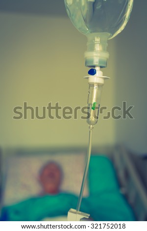 Infusion bottle with IV solution ( Filtered image processed vintage effect. )