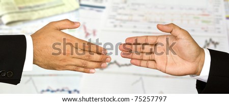 Two business male hands about to shake hands