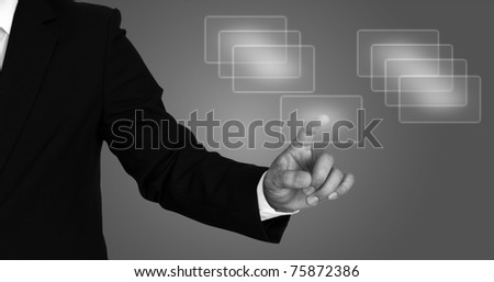 Business hand pushing a button on a touch screen interface  (gray scale)