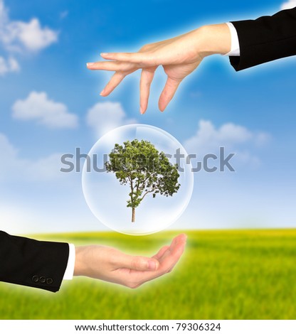 Eco concept  : Hand with tree in bubbles