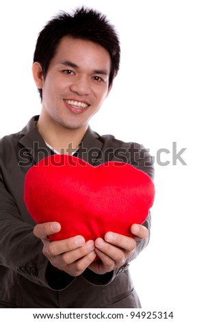 Business man with red heart isolated on white