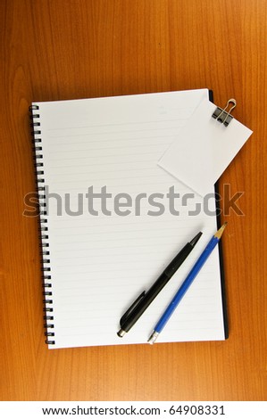 paper clip paper note notebook pen and pencil
