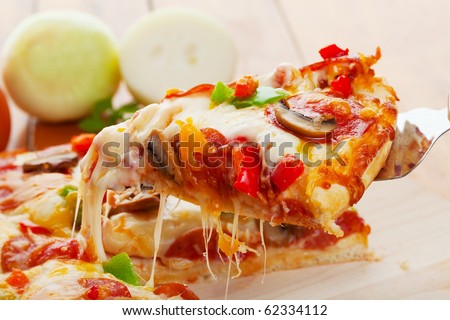 A Slice of supreme pizza being lifted up