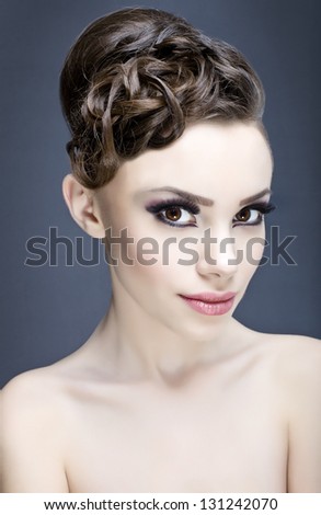 Seductive girl super model  posing beauty in studio with hairstyle