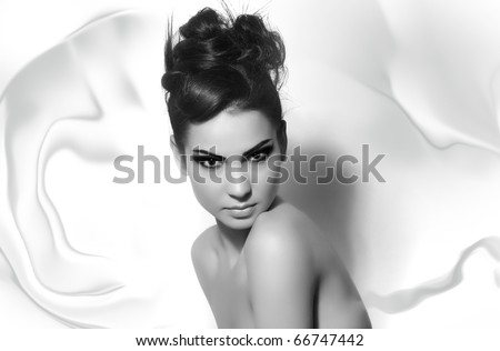 beautiful fashion model with long hair and loop of hair black and white