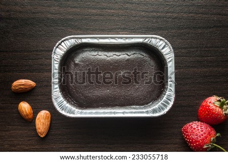 Foil box of chocolate cake.