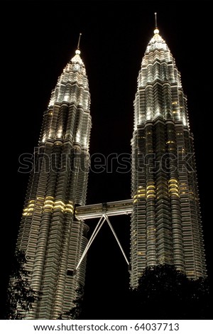 KUALA LUMPUR - OCTOBER 30 : Beautiful night lighting of Petronas Twin Towers (KLCC). The Petronas Twin Towers remain the tallest twin buildings in the world October 30, 2010 in Kuala Lumpur, Malaysia.