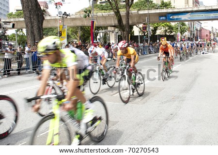 KUALA LUMPUR, MALAYSIA - FEB 1: Cyclists pedal their way at the final stage of le Tour de Langkawi on February 1, 2011 in Kuala Lumpur Malaysia