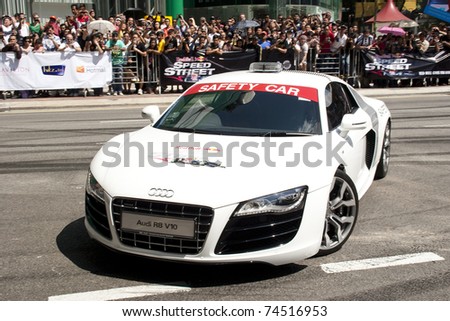 KUALA LUMPUR, MALAYSIA-APR 3:Safety Marshall rides an Audi R8 V10 inspect the street prior to the F1 street show on Apr 3, 2011 in Kuala Lumpur.The event is a promotion for F1 Malaysia Grand Prix 2011