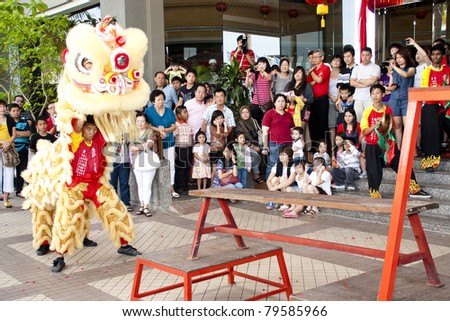 MALACCA, MALAYSIA-FEB 5:Dancer from the Chinese community performing Dragon Dance during Chinese New Year on February 5, 2011 in Malacca, Malaysia. In Chinese Horoscopes 2011 is the year of the Rabbit