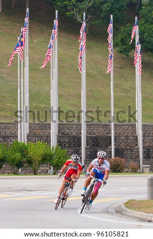 PUTRAJAYA, MALAYSIA - FEB 18: Unidentified cyclists from Chinese Taipei team in the Elite Men's Road Race during the 32nd Asian & 19th Junior Asian Cycling Championships on Feb 18, 2012 in Putrajaya, Malaysia.