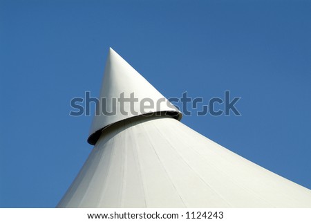 Pointed top of a white canvas roof
