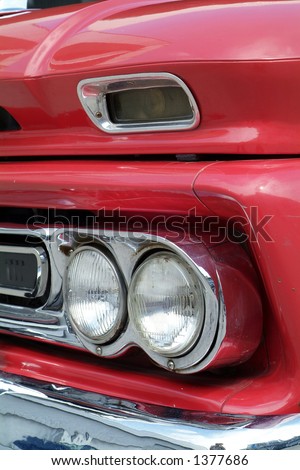 Front detail of red American pickup truck from the sixties