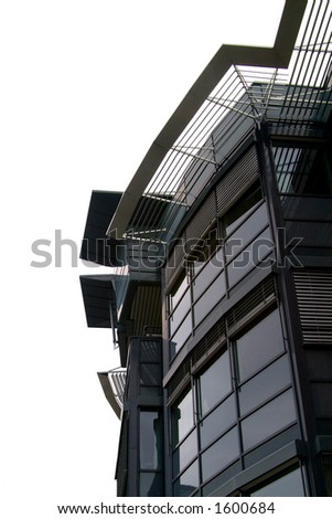 Detail of top floors of contemporary style office building. Isolated.