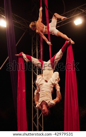 BANGKOK, THAILAND - DECEMBER 13: Members of the Dutch acrobatic dance group Bencha Theater during a performance at the International Street Show on December 13, 2009 in Bangkok, Thailand.