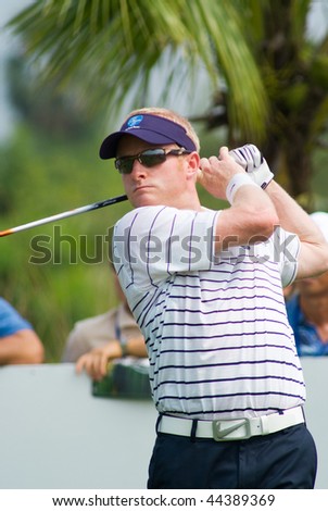 BANGKOK, THAILAND - JANUARY 8: English golf player Simon Dyson tees off at the Royal Trophy tournament, Asia vs Europe, at Amata Spring, Bangkok, Thailand on January 8, 2010.