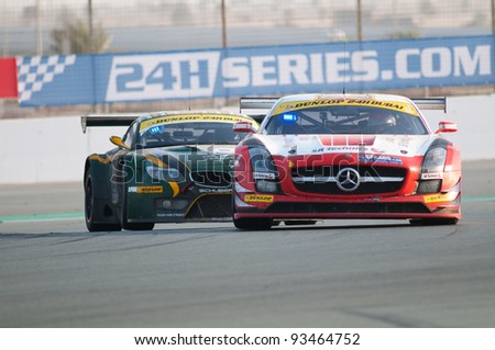 DUBAI - JANUARY 14: Race winner, a Mercedes SLS AMG GT3 in front of last year\'s winner, a BMW Z4 GT3, during the morning hours of the 2012 Dunlop 24 Hour Race at Dubai Autodrome on January 14, 2012.
