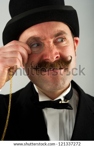 Headshot Of English Gentleman Adjusting His Monocle Which He Is Having ...