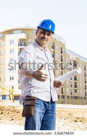 Portrait of smiling architect at construction site.