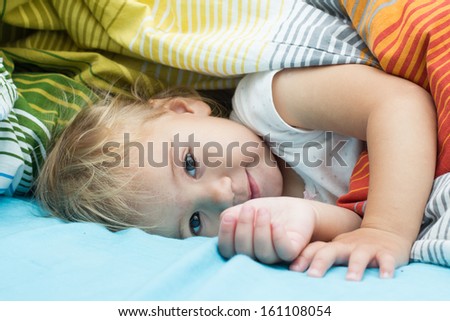 Portrait of cute happy little girl after sleep.