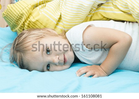 Portrait of cute happy little girl after sleep.