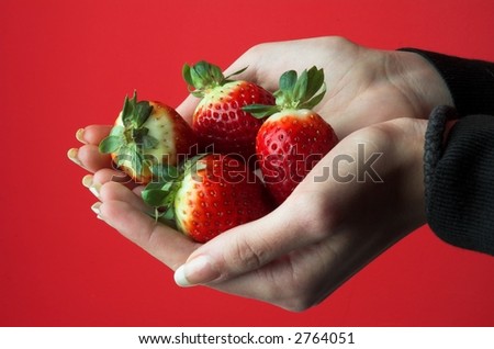 Strawberry in hand.