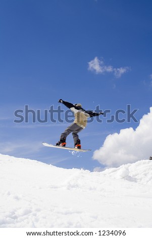 Snowboarder jumps in the air - professional