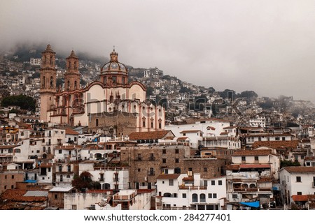 Hazy view of Santa Prisca church in Taxco de Alarcon, Guerrero, Mexico.
