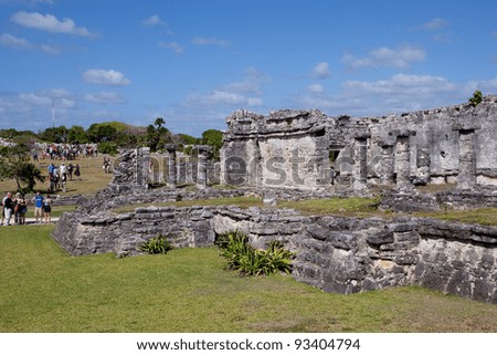 TULUM, MEXICO - JAN 02: Tourists visit the ancient ruins, Tulum was one of the last cities inhabited and built by the Mayans. Tulum, Riviera Maya, Mexico on Jan 02, 2012.