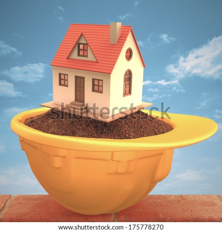 House over the earth inside the hardhat. Concept of construction and protection. Clipping path included.