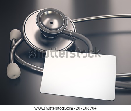 Stethoscope and blank card on the table. Your medical information on the card. Clipping path on the card.