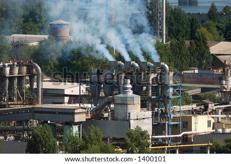 Factory chimney pipes polluting the air with smoke